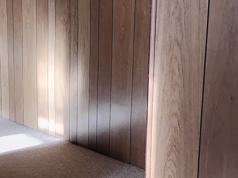 hall from bedroom to kitchen and living room, small closet on right in hall