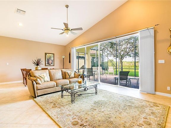 Most popular open floor plan.  Great Room 15 x 25 with high ceilings, diagonal tile floors, and wall of sliding doors.