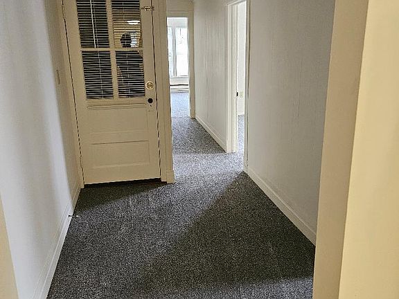 Hallway & entry door at top of stairs