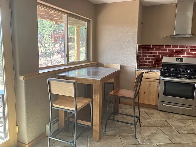Enjoy your meals at the bar table, which has mountain views.