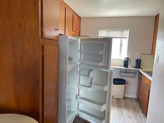 Kitchen with new full-size fridge
