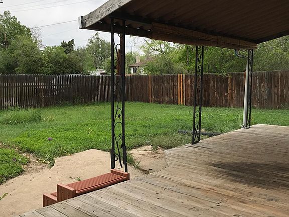 Deck and large fenced in backyard.
