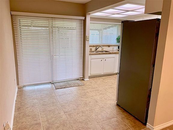 BREAKFAST ROOM WITH TILE FLOORING AND FRESH NEUTRAL PAINT