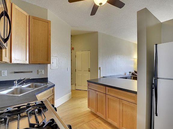 In the kitchen, facing the door to enter the unit