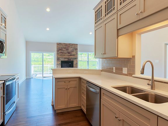 View from kitchen into family room area with firelace, Chilton plan