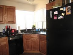 Kitchen with cherry cabinets, granite counters and new appliances.