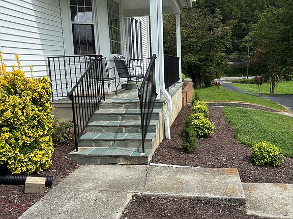 Side porch entrance into knotty pine room