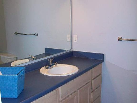 Large bathroom w/marmoleum floors and step-in shower