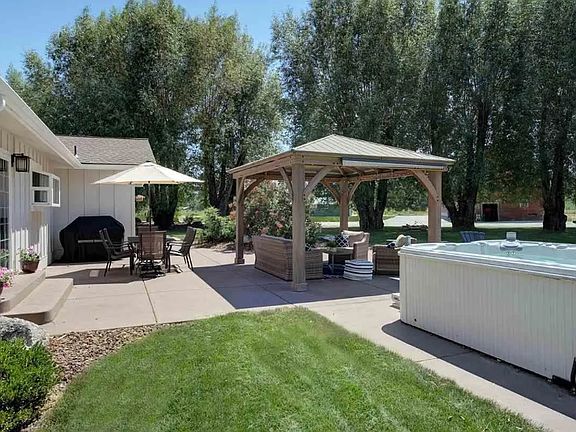 Back patio is just off kitchen/dining space with slider door.