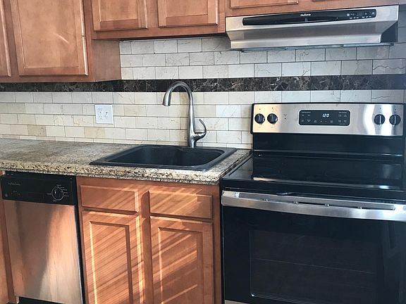 Maple Cabinetry and granite tile countertops