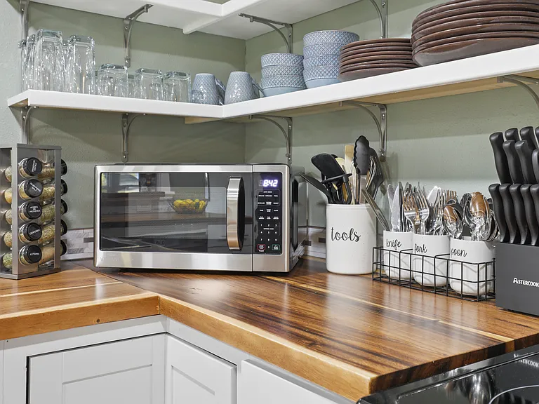 Fully stocked kitchen with drip coffee maker, blender, pots, pans, seasonings, etc. All your kitchen needs are here.
