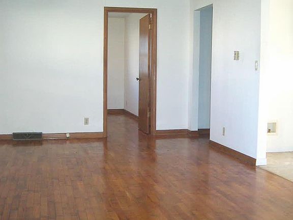 Living Room with Hardwood Floors and Ceiling Fan