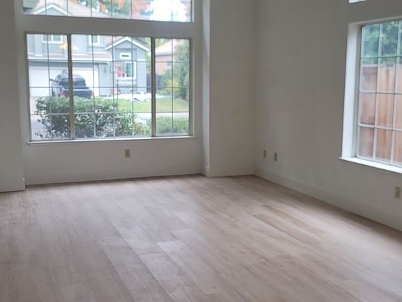 Very large living room/dining room with high ceilings, light and bright.