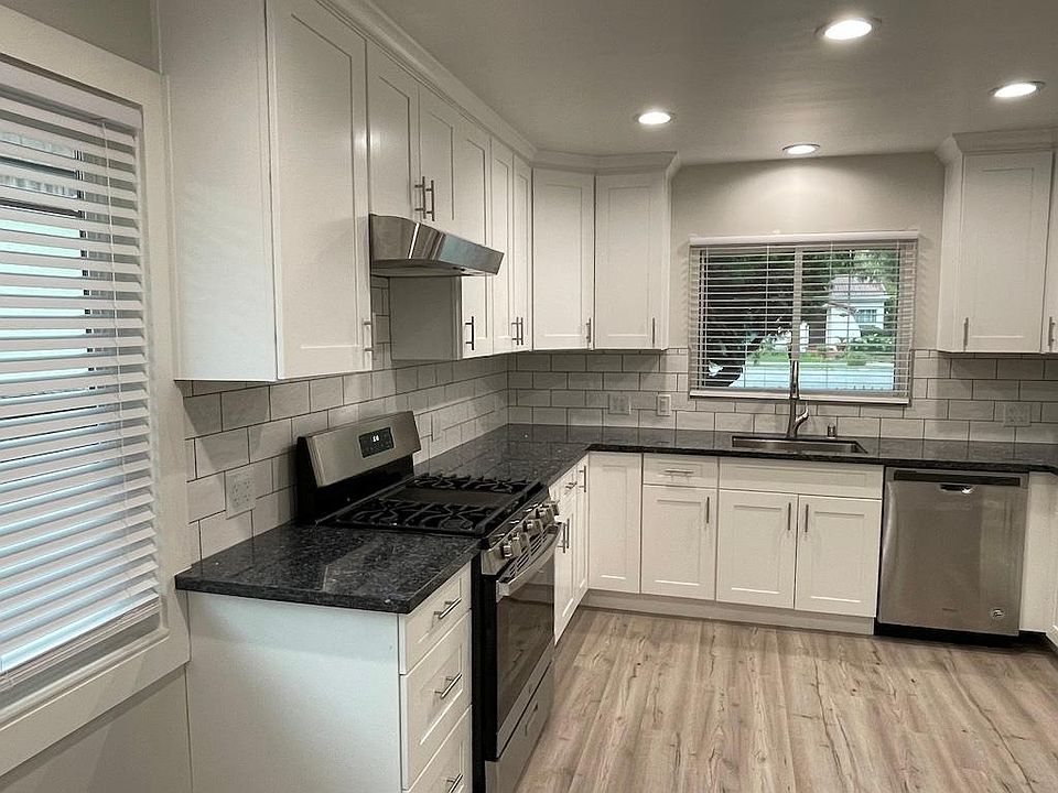 Newly remodeled kitchen with gas stove and dishwasher.