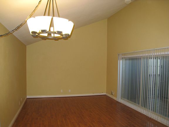 living room with vaulted cieling, large sliding glass door