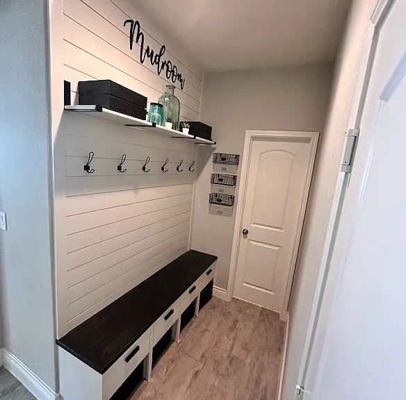 Mudroom off garage with an additional storage closet