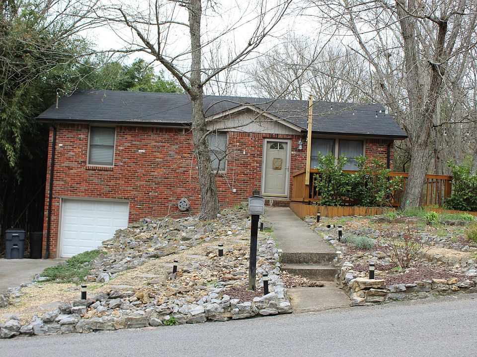 Outside of this beautiful ranch house with a great front deck
