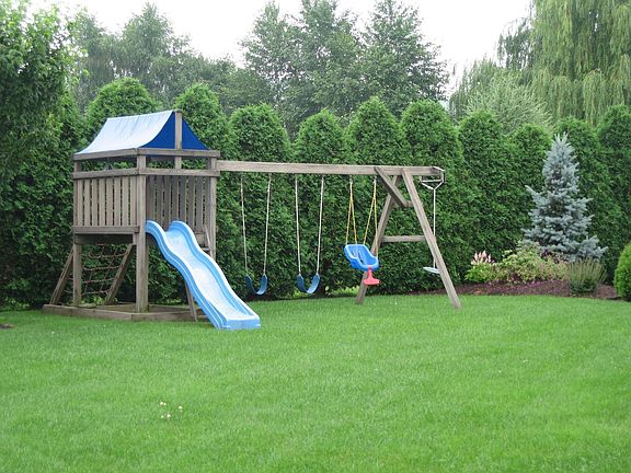 private backyard with playscape
