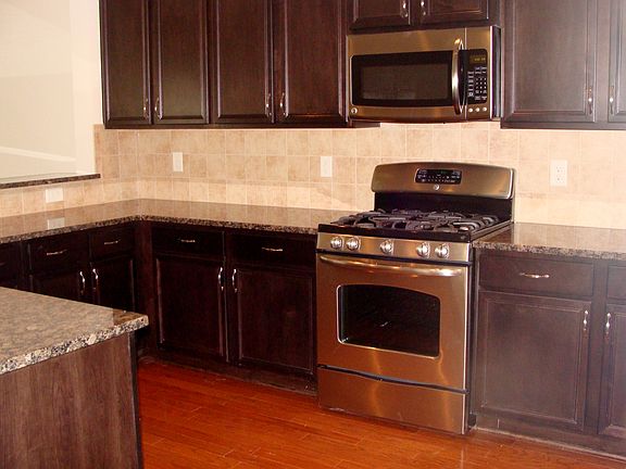 Kitchen with granite and steel appliances