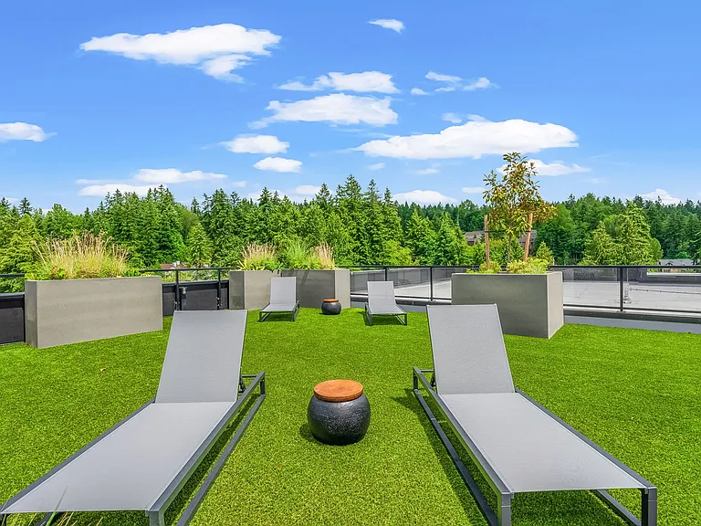 Chairs basking in the glow: where rooftop relaxation meets sunny perfection __