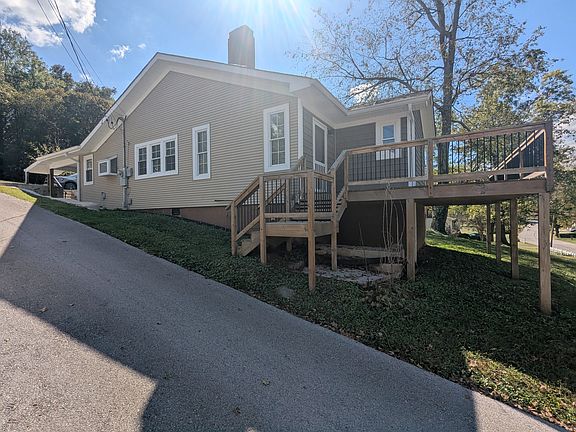 View from driveway. Master bedroom is in front and exits onto the deck.