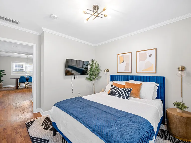This room features a 43" Roku TV and a small closet, providing convenient storage solutions without compromising on aesthetics. Close the blackout curtains before jumping into the queen-sized bed for ultimate relaxation.