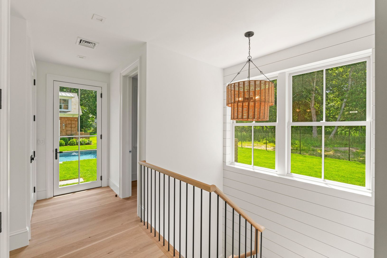  Half Bath Entry and Lower level access- Custom oak stairs and plenty of natural light 