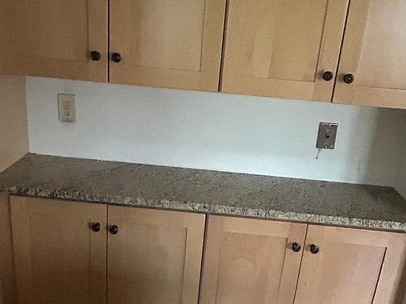 More cabinets on opposite side to sink