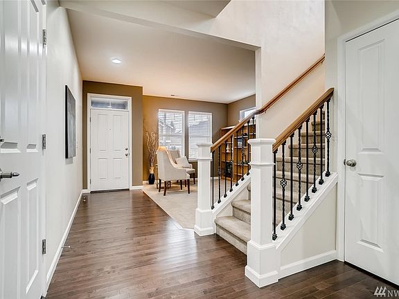 Stylish entry greets you with gleaming Engineered Plank flooring.