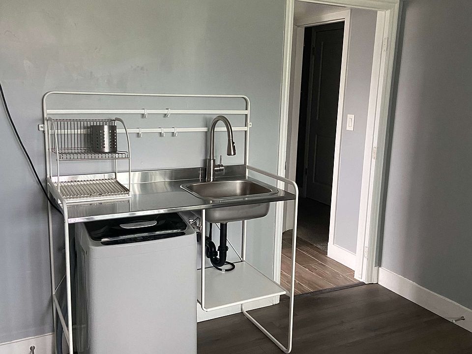 Kitchen with washer below sink