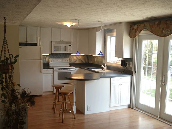 Modern kitchen w/ French doors leading to new (2007) patio area