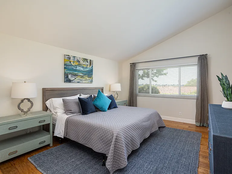 Relax in the peace and privacy from your Primary Bedroom. The Primary Bedroom is on one end of the room and the two bedrooms are at the other end of the room.