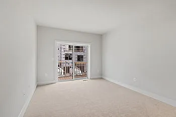upper floor living room / flex space with walk out deck