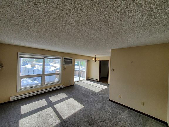 Living room looking toward dining room and patio door.