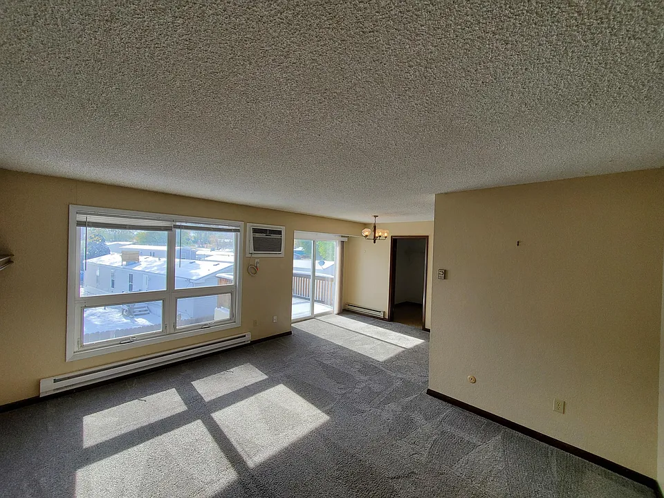 Living room looking toward dining room and patio door.