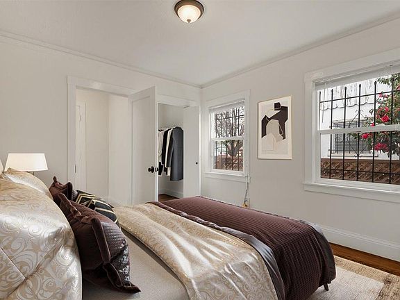 Main bedroom with two large windows and walk in closet. This bedroom has two entrance and exits as well. (Those yellow devices on the windows are kick-plates. Kicking those will pop open the grate on the exterior of the window). 

(Furniture added digital