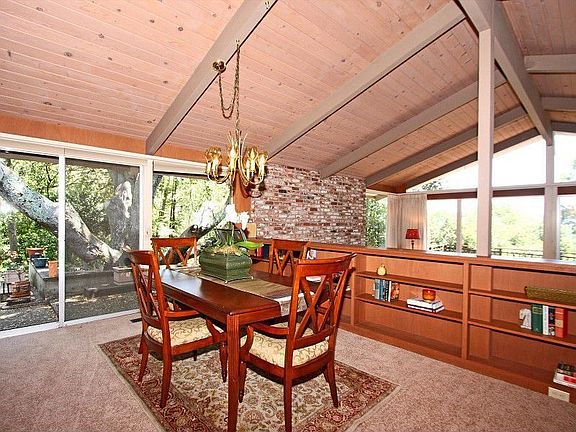 Dining room looks out over sunken living room