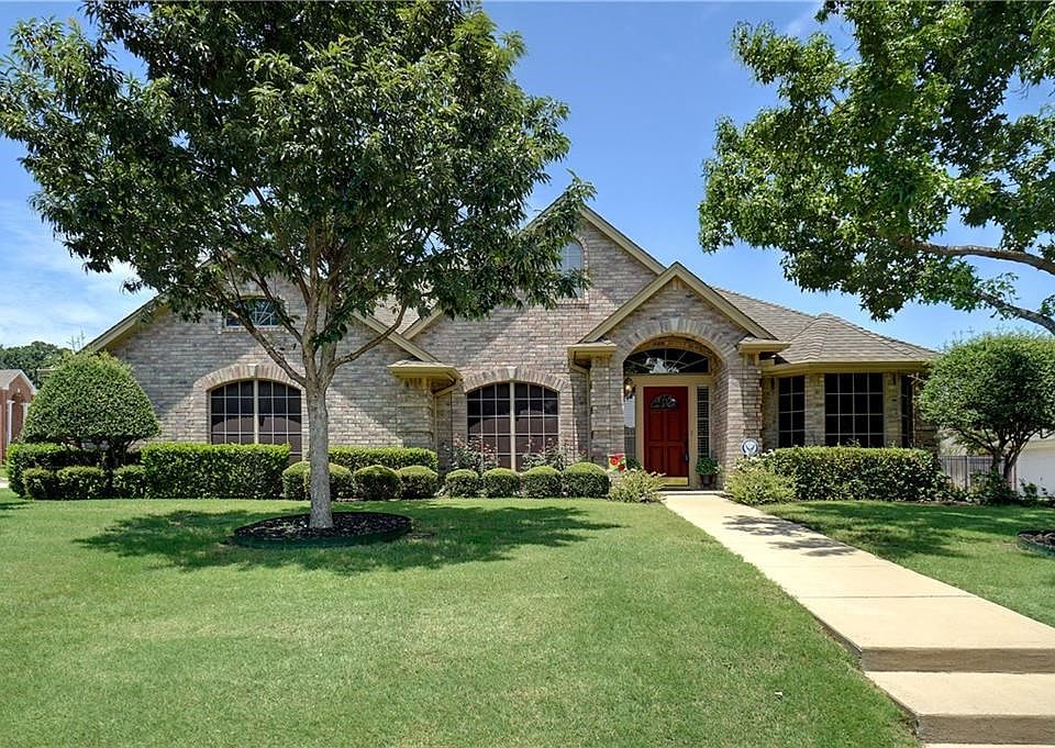 Beautiful custom home with side entry garage and corner lot