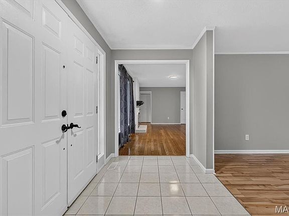 Front entry way to living room and family room.