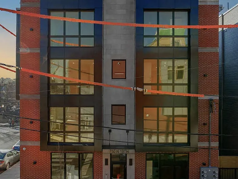 Exterior of the building. Out unit is the left side of top 2 floors and the left roof top.