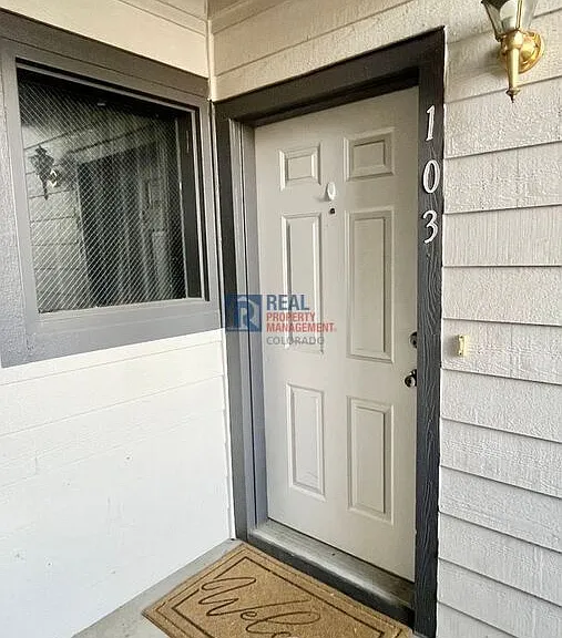 10784 W 63rd Pl #103 — Photo 3