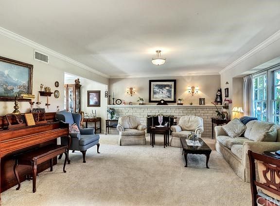 Another view of the formal living room, which leads into the formal dining room.