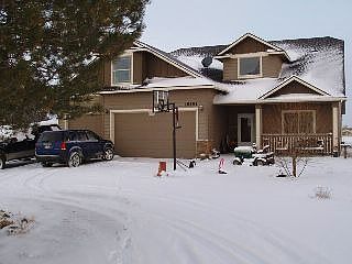 Front of house w/circular driveway