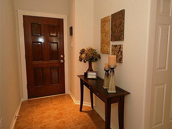 The entry way has a skylight, not visible in this picture, a tile floor, and an art niche (also not visible here)