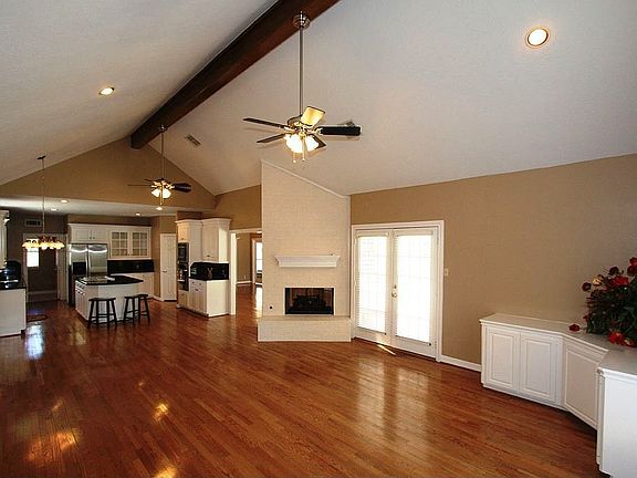 View of Kitchen & Family Room. Family Room features built-in cabinets.