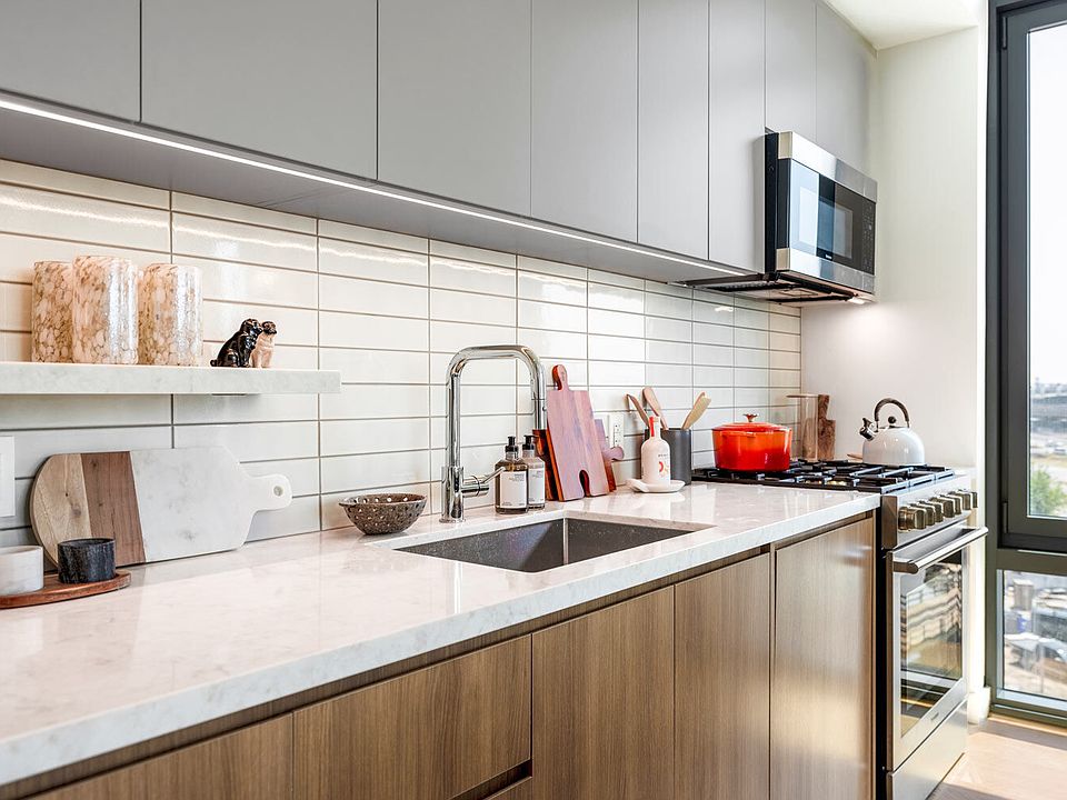 Quartz countertops, stainless steel appliances, and in-home dishwashers