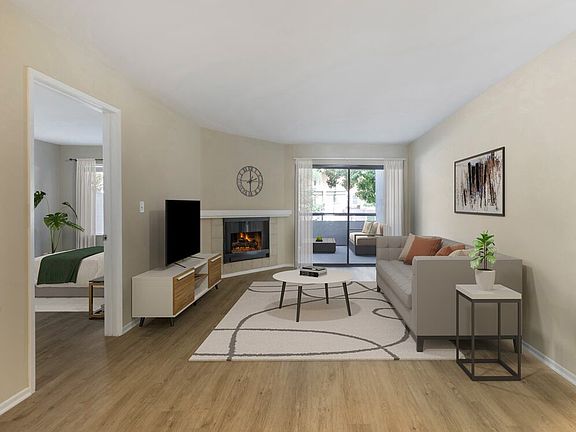 Renovated Package II living room with hard surface flooring