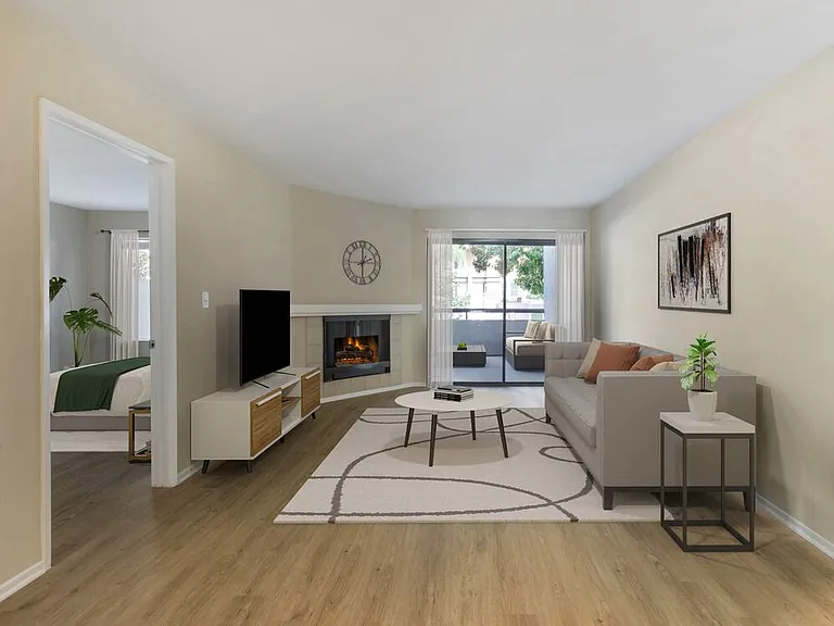 Renovated Package II living room with hard surface flooring