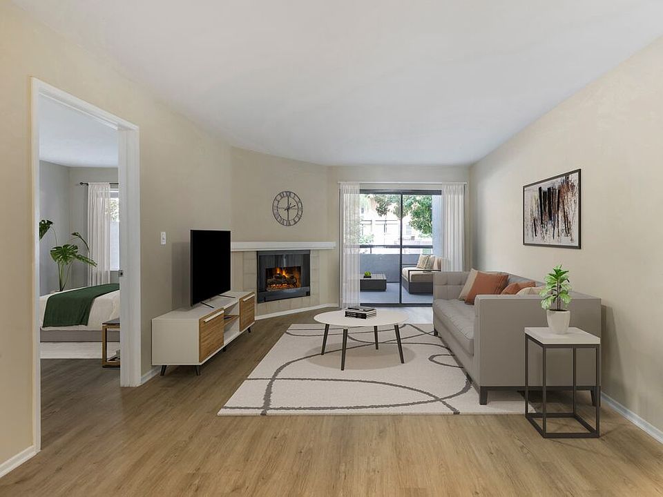 Renovated Package II living room with hard surface flooring