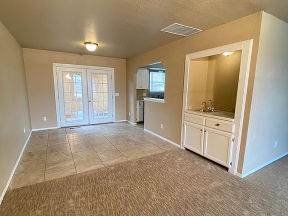 Living room, wet bar, dining room